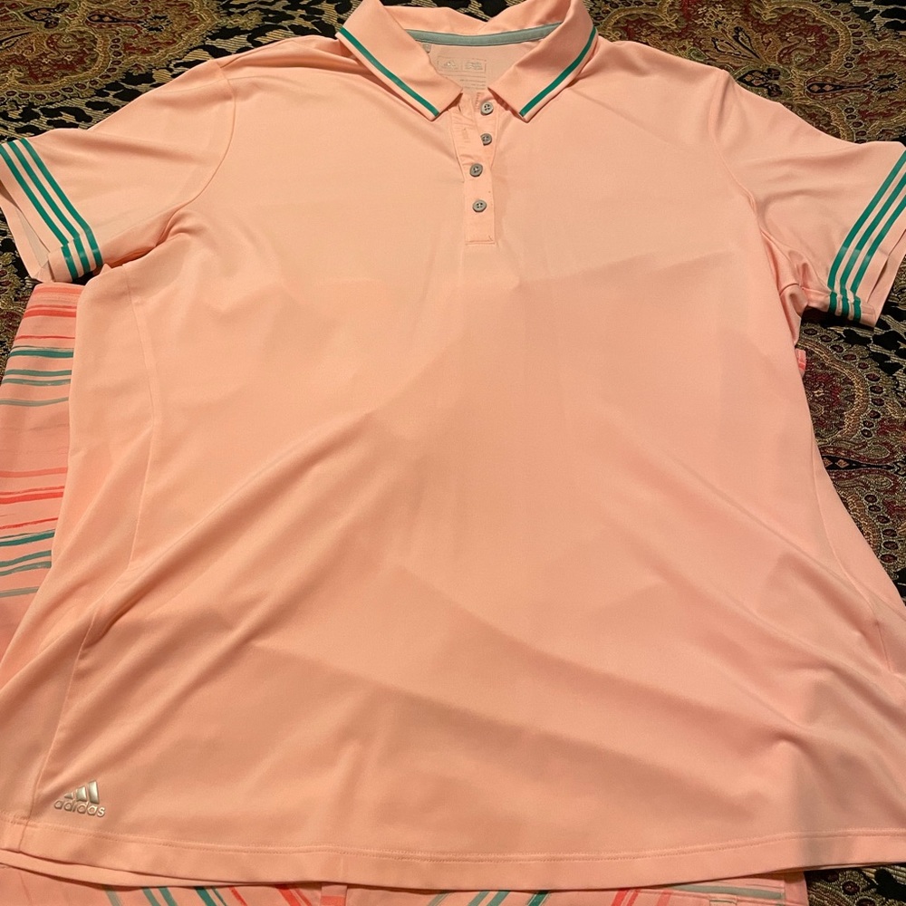 Women’s golfing outfit. Shorts and shirt.